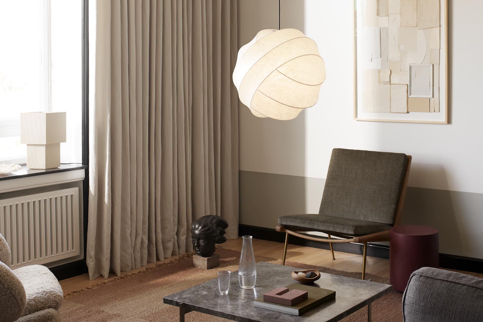 Mid-century modern living room with beige curtains, abstract art and minimalist pendant lamp | New finds - October 2021 | These Four Walls blog