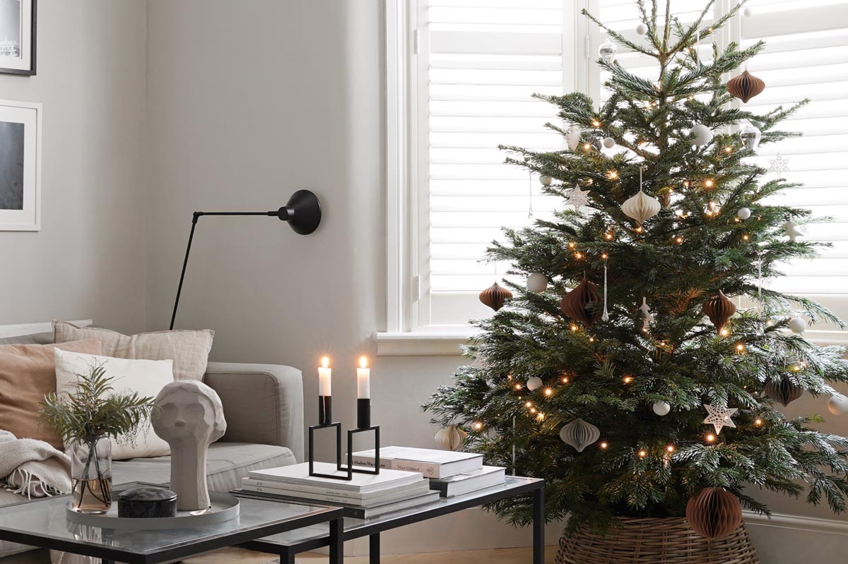 Minimalist living room and simple Christmas tree dressed in white, grey, silver and earthy neutrals | These Four Walls blog