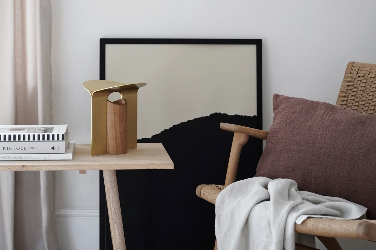 Cosy reading nook in a minimalist beige and white bedroom, with Carl Hansen & Søn' timeless RF200 table lamp and CH25 chair | These Four Walls blog