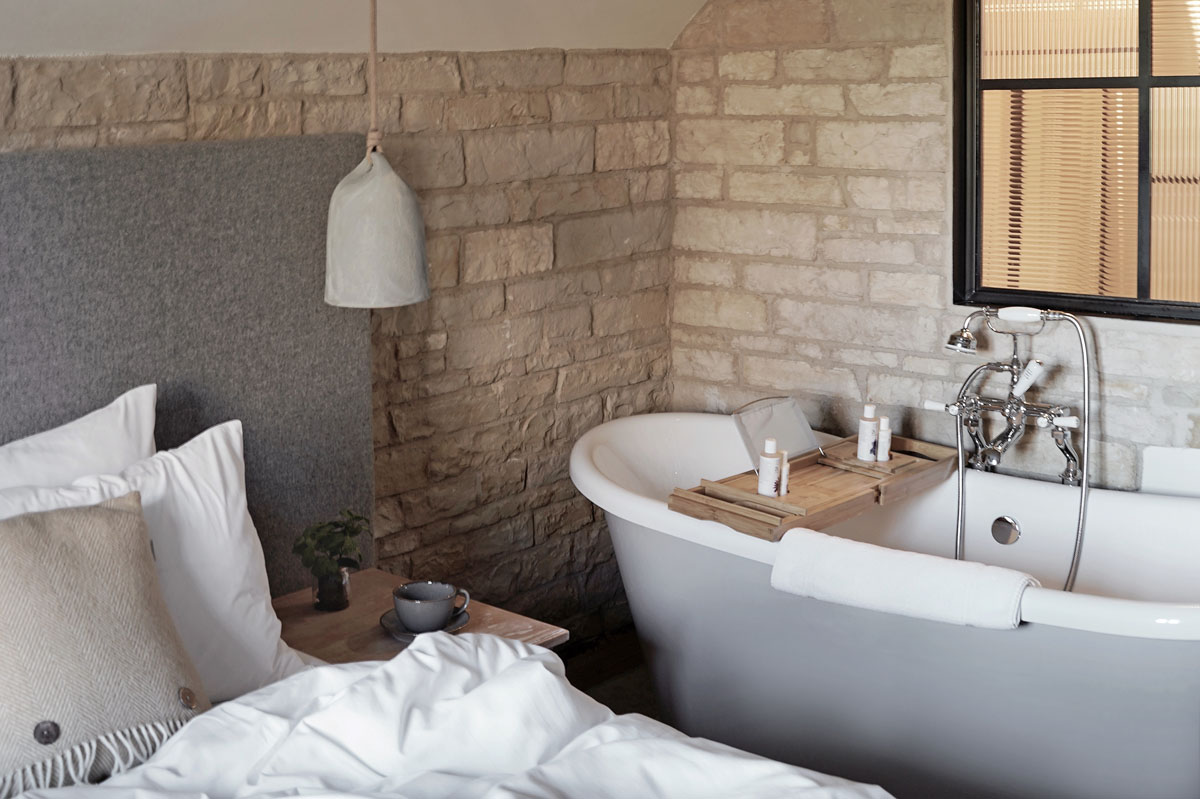 Rustic-minimalist bedroom at stylish Cotswolds hotel Wild Thyme & Honey - the perfect place for a cosy winter staycation | These Four Walls blog