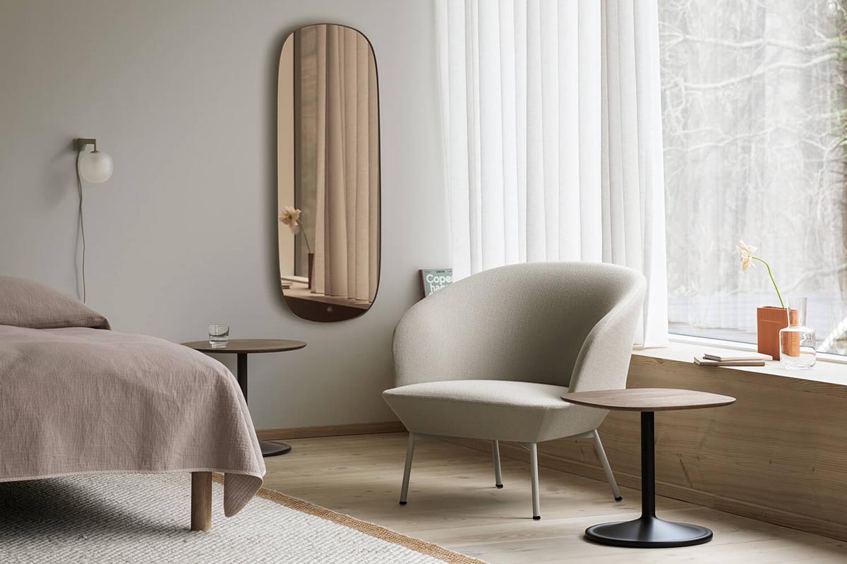 Minimalist neutral bedroom with beige lounge chair from Nordic design brand Muuto's Oslo seating series | New finds - May 2022 | These Four Walls blog