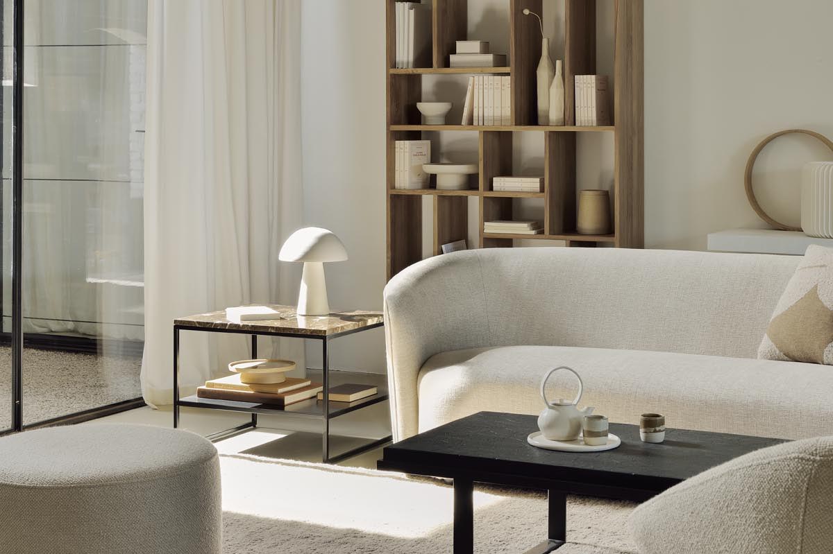 Neutral living room in earthy beige and brown, with minimalist design, curved sofa and sculptural accessories | New designs from Belgian brand Ethnicraft | These Four Walls blog