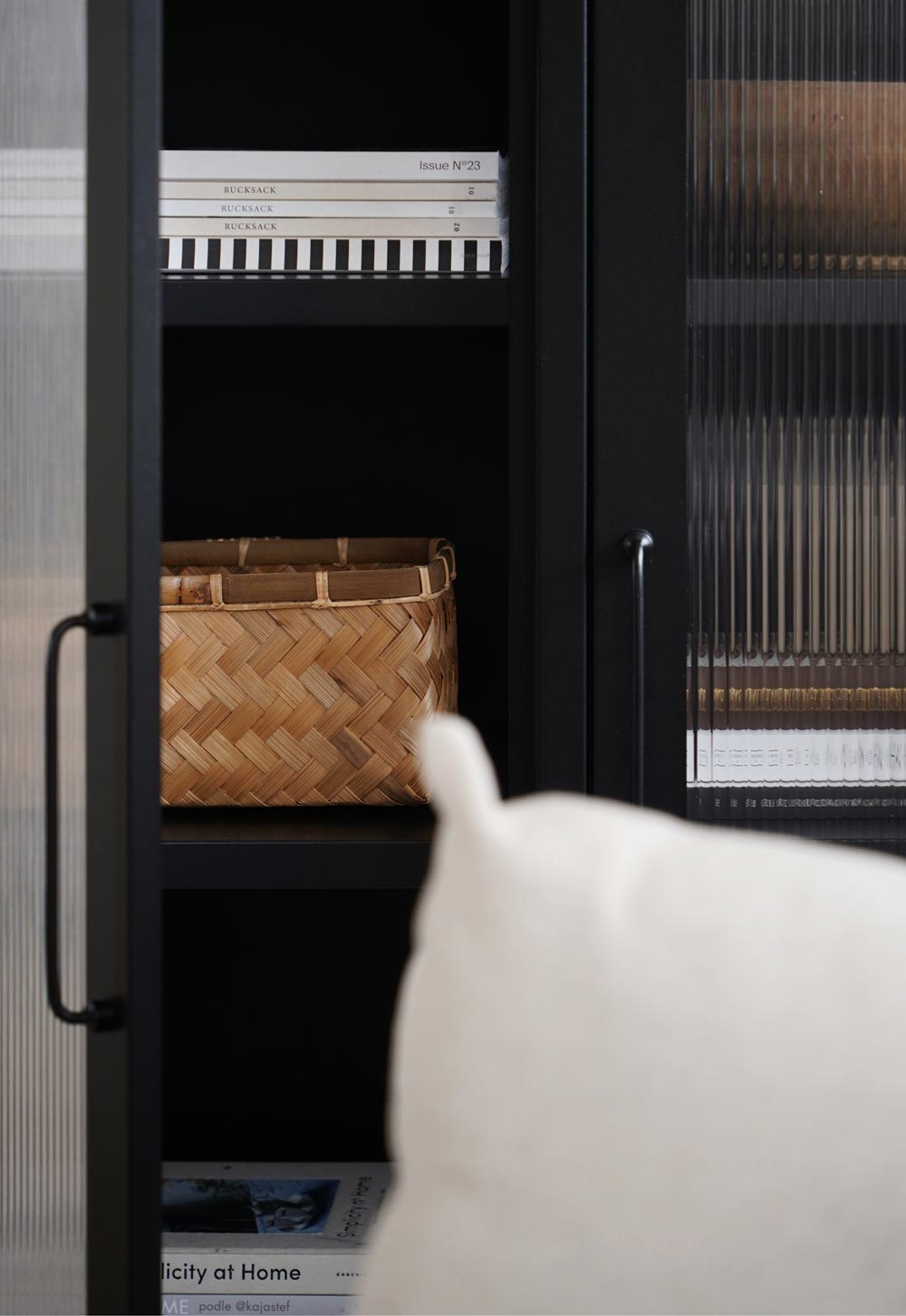 Black reed-fronted display cabinet from Bisley with rustic-minimalist styling and wicker basket | These Four Walls blog