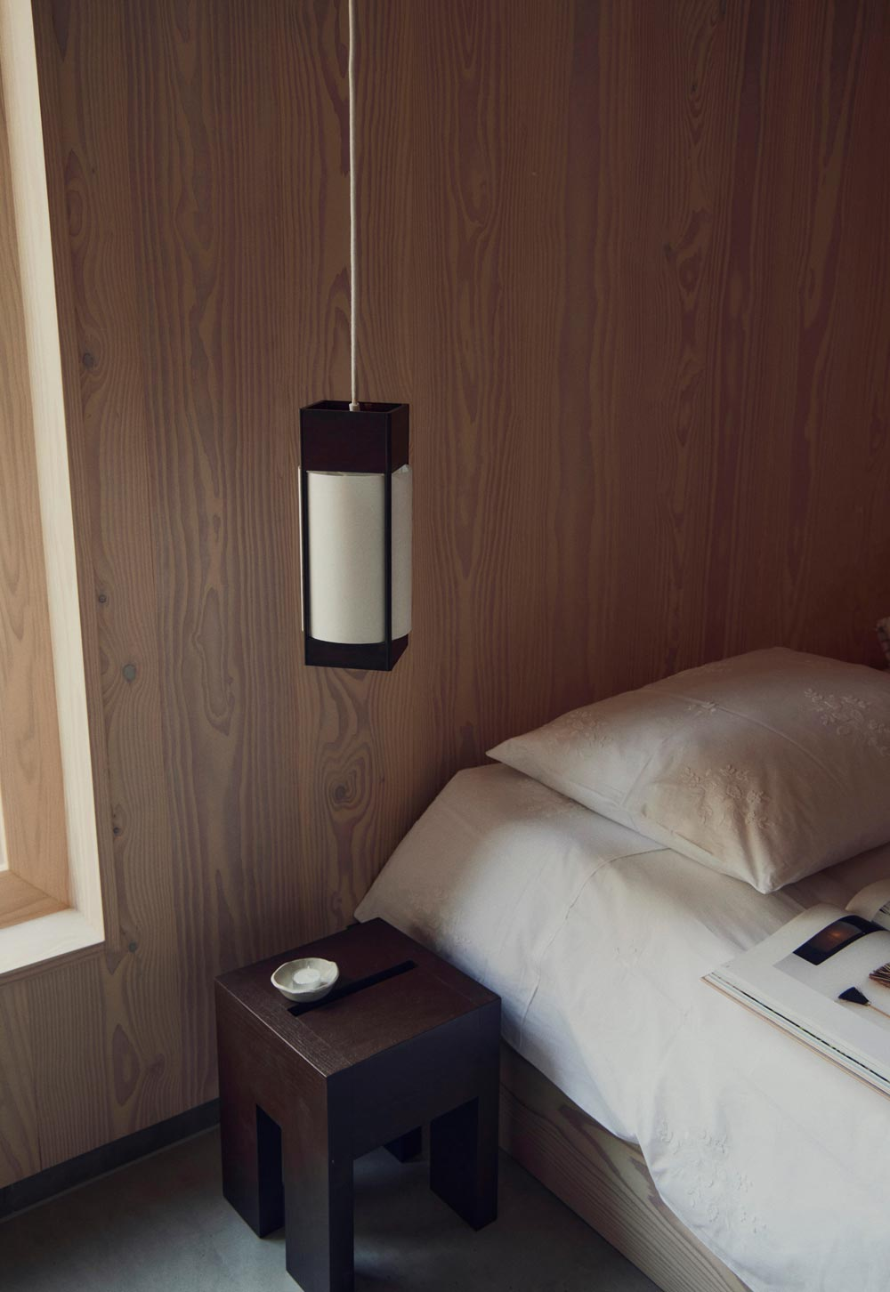 Minimalist wood-clad bedroom with Japanese-inspired bedside pendant light in wood and paper from Form & Refine's 'Andon' Collection | New design finds - July 2026 | These Four Walls blog