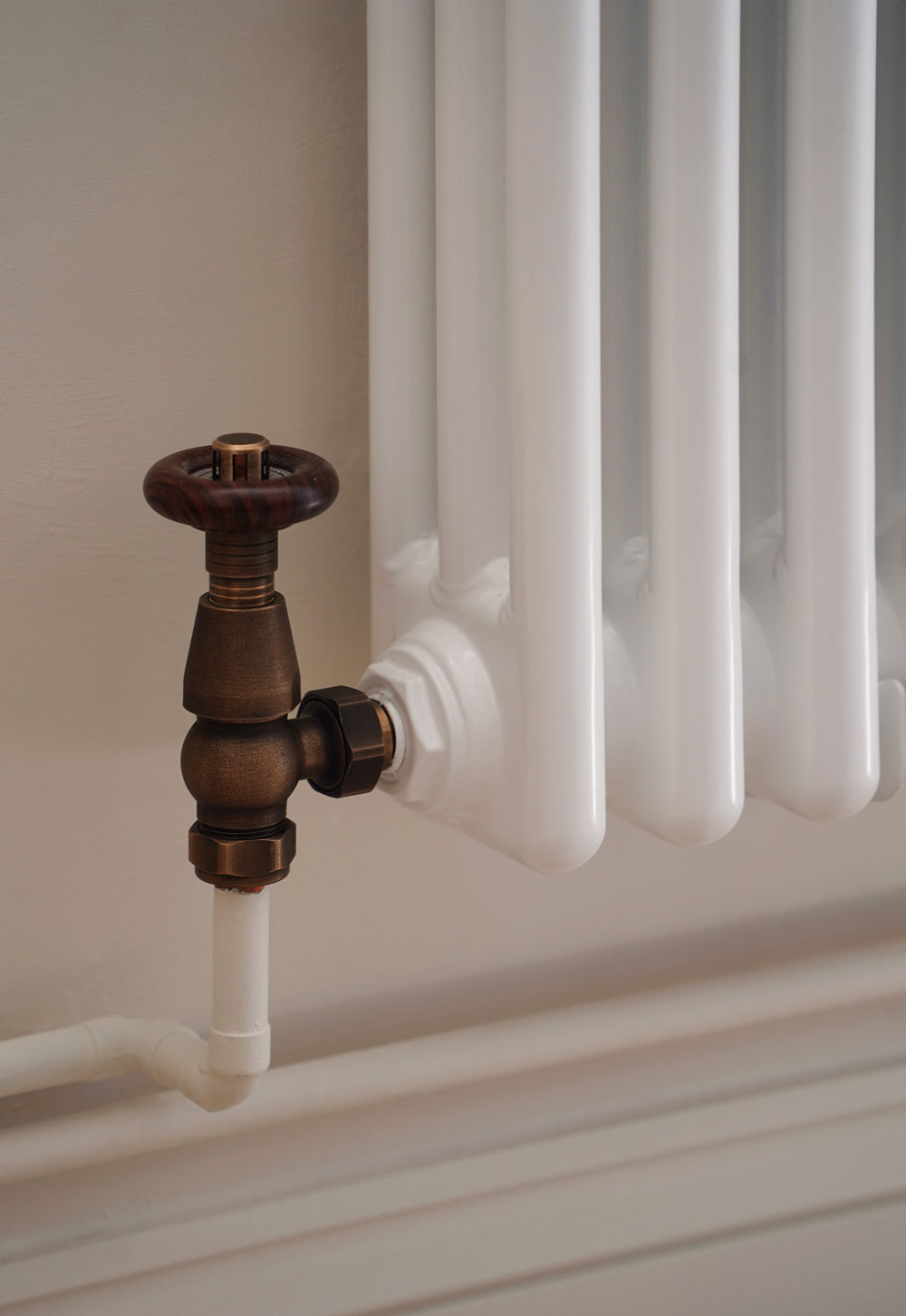 White Milano Windsor column radiator and brass valve from BestHeating in a rustic-minimalist cottage interior | These Four Walls blog