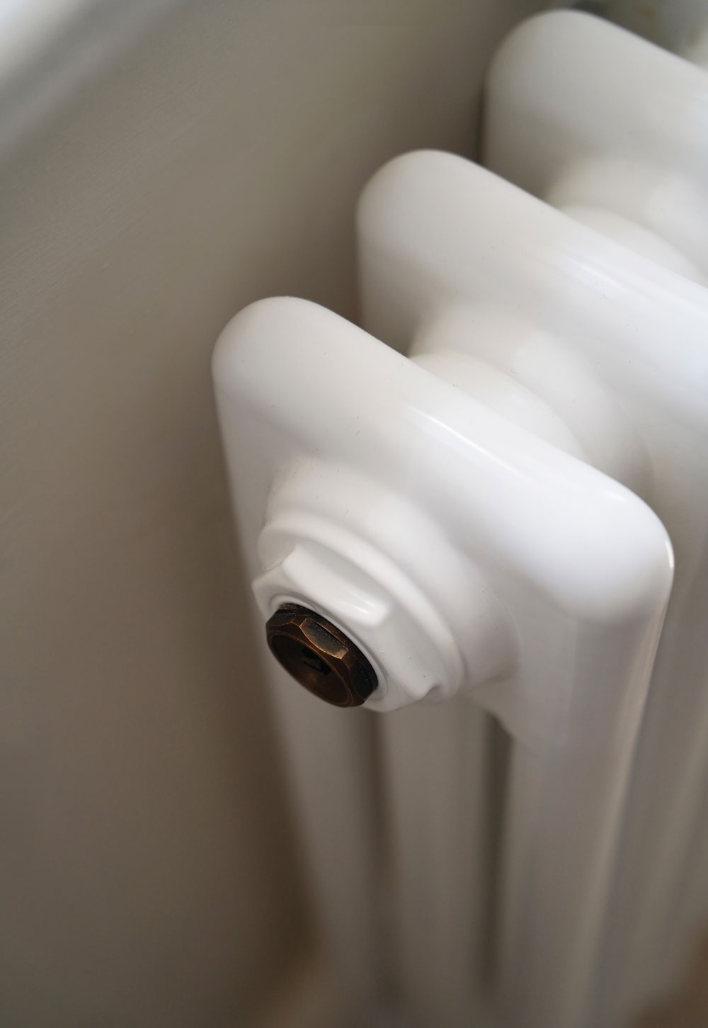 White Milano Windsor column radiator from BestHeating in a rustic-minimalist cottage interior | These Four Walls blog