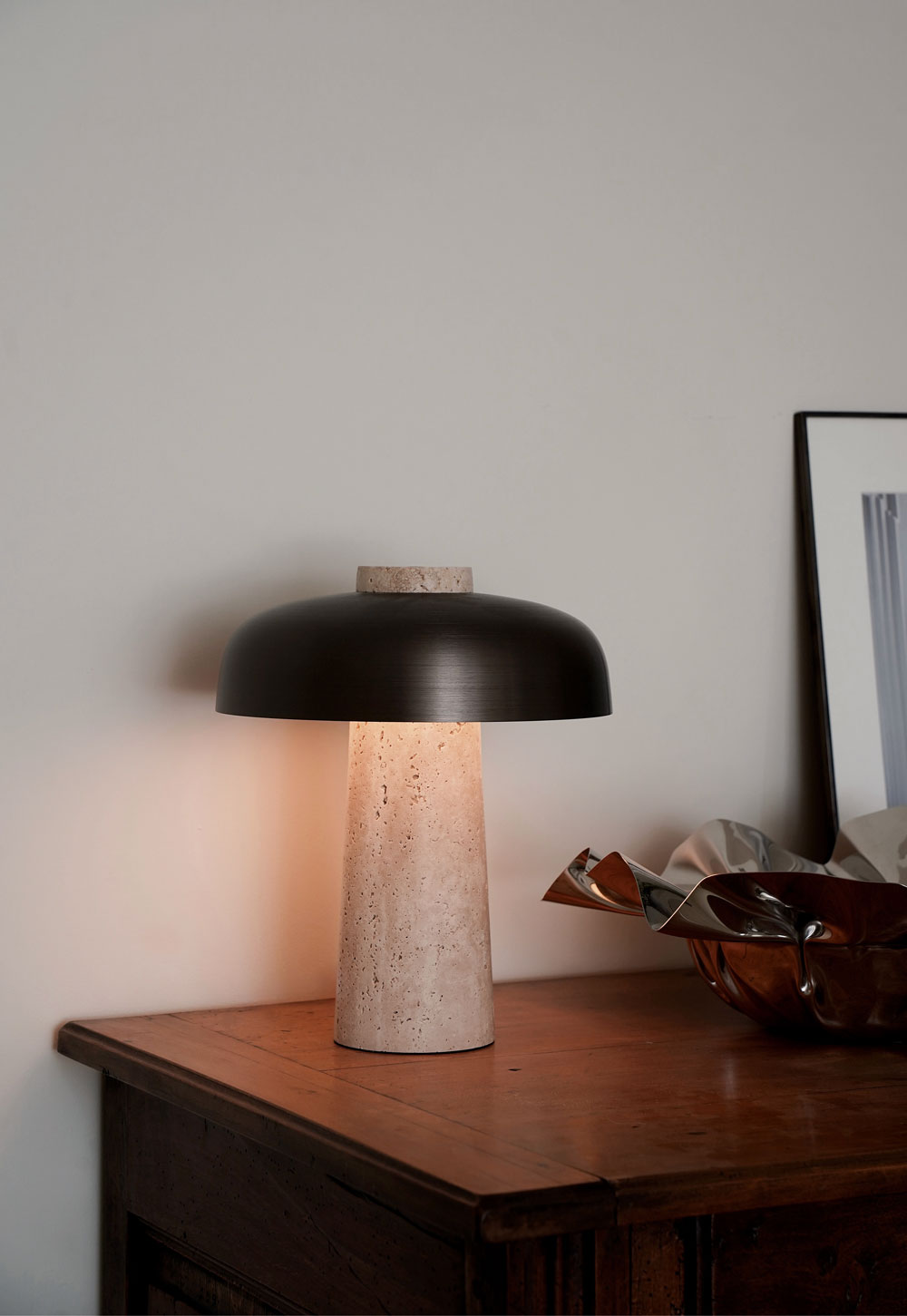 Antique sideboard, sculptural steel bowl and contemporary travertine lamp in a rustic-minimalist cottage interior | These Four Walls blog