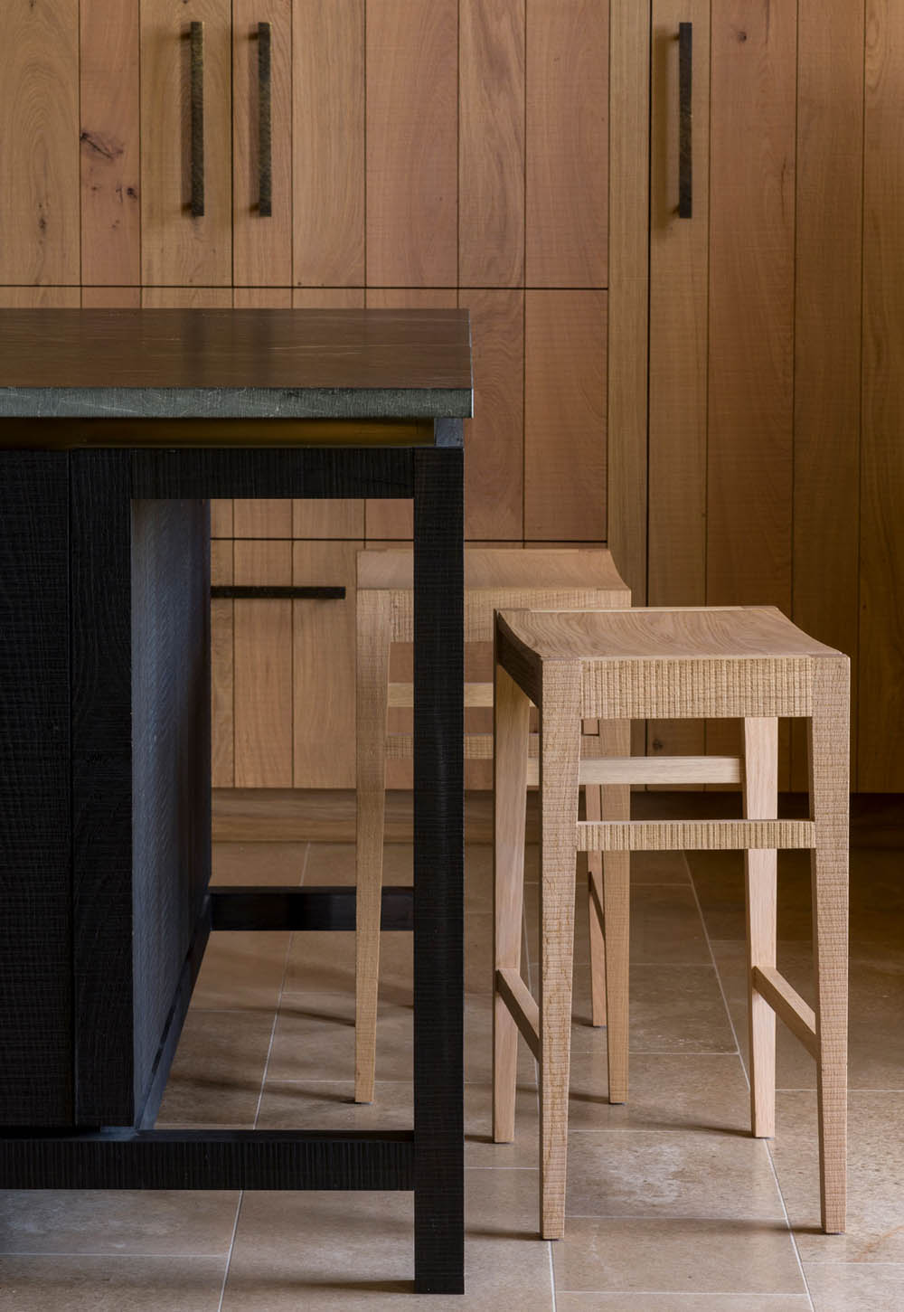 Rustic oak kitchen with black island unit and band-sawn bar stools from Inglis Hall | New design finds - July 2026 | These Four Walls blog