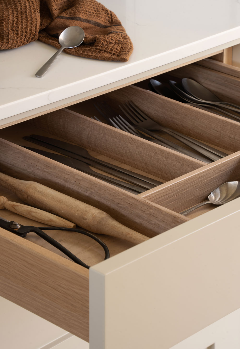 Minimalist beige Shaker kitchen with oak drawers and marble worktop | These Four Walls blog